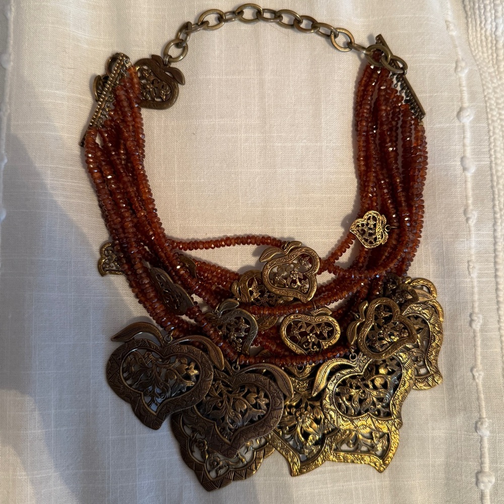 Stephen Dweck Gold and Brown Statement Necklace with Intricate Charms